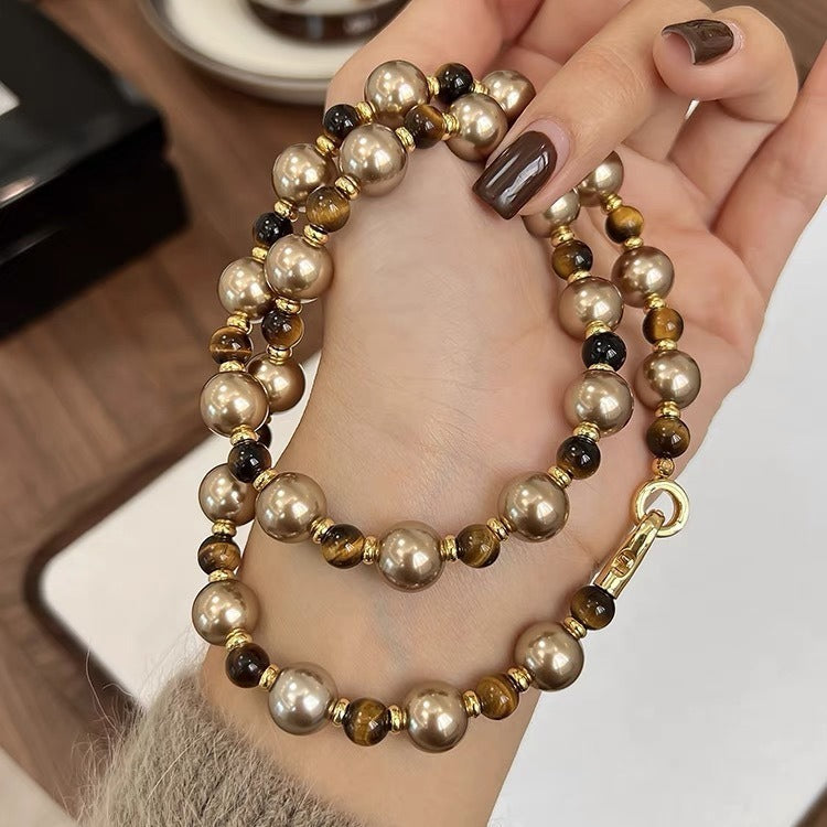 Autumn and winter Maillard Tiger Eye stone Mocha gold brown Shi Jia pearl necklace women's choker superior sense folded sweater chain long